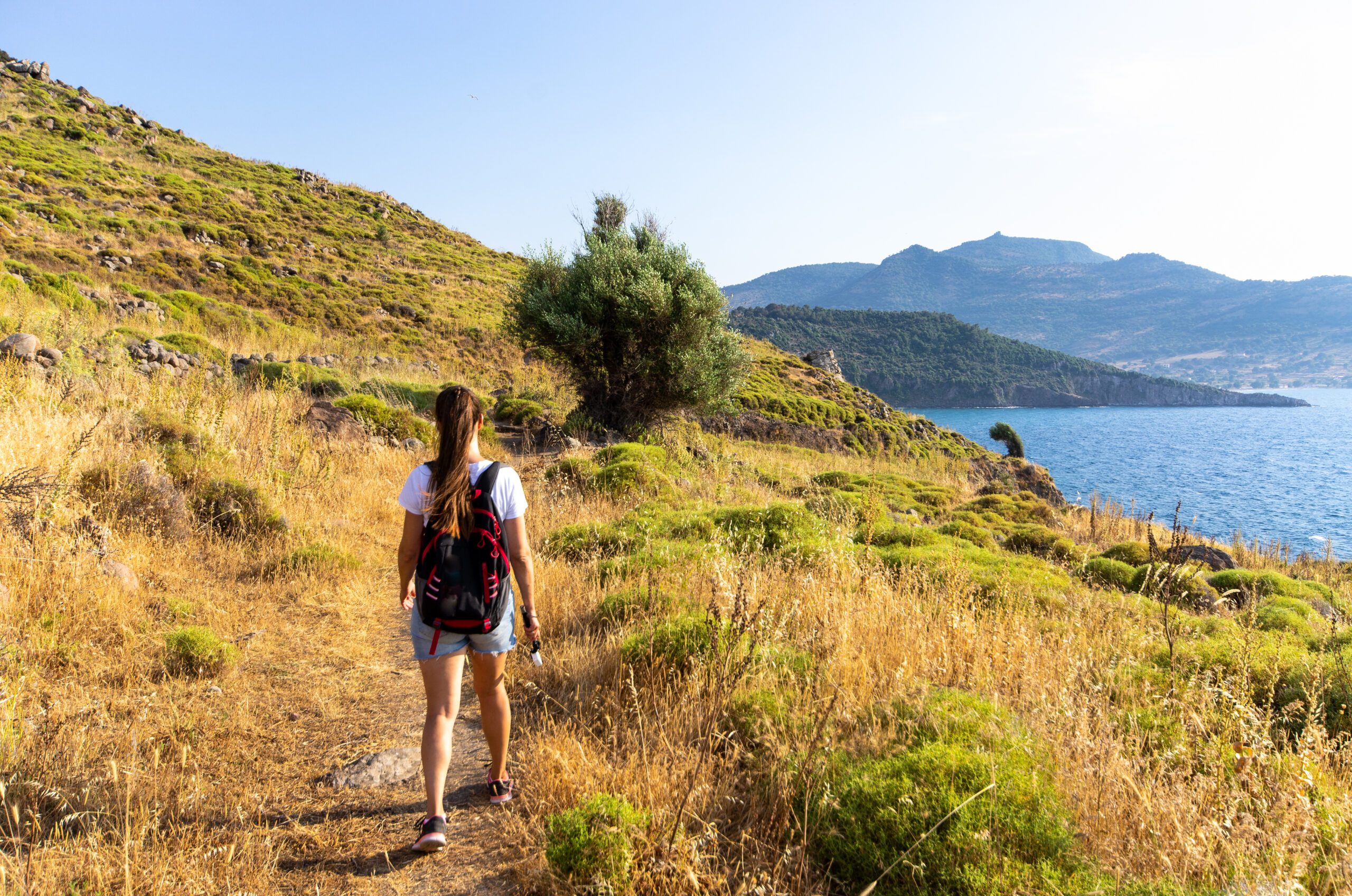 woman hiking on coastline